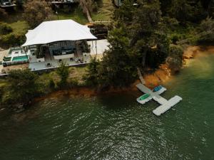 an aerial view of a cross in a body of water at Porto Marina Hotel in Guatapé +82 photos
