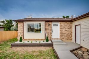 a brick house with a white door at Luxury Spacious House Great For A Family Retreat in Loveland