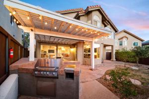 a patio with an outdoor kitchen in a house at Rancho Bernardo Home - Game Room Outdoor Living in Rancho Bernardo