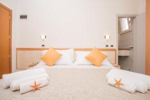 Postel nebo postele na pokoji v ubytování Hotel Oregon