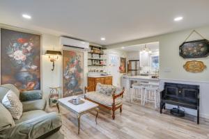 a living room with a couch and a fireplace at Hot Tub and Fenced Yard Cozy Cottage Grove Home in Cottage Grove