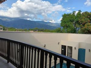 a balcony with a view of the mountains at Hotel Boutique Lomas Colonial in Santa Fe de Antioquia