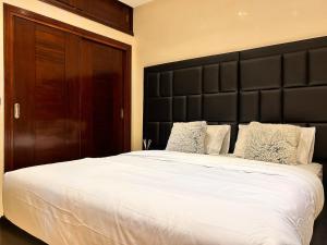 Postel nebo postele na pokoji v ubytování Dar Mina - Appartement Agadir