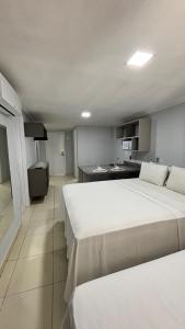 a hotel room with two beds and a kitchen at Blue Sunset Family Experience in João Pessoa +54 photos