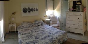 Ein Bett oder Betten in einem Zimmer der Unterkunft Apartamento Playa Muralla