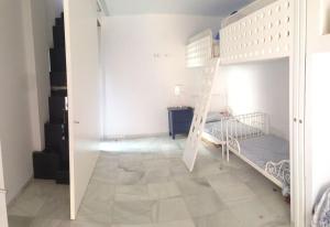 Ein Bett oder Betten in einem Zimmer der Unterkunft Apartamento Playa Muralla
