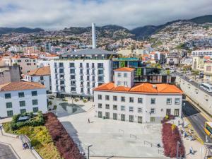 an aerial view of a city with buildings at Luxury 5-Star Stay at Savoy Insular in Funchal