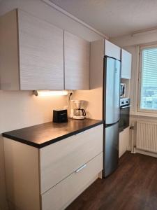 Kuchyň nebo kuchyňský kout v ubytování Central Apartment for 3 in Kuopio Center