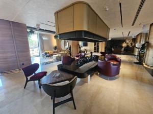 a large living room with a couch and chairs at Apartment Rajski 717 in Zlatibor