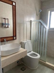 a bathroom with a toilet and a sink and a shower at Apartment in Naama Bay, Sharm El Sheikh in Sharm El Sheikh