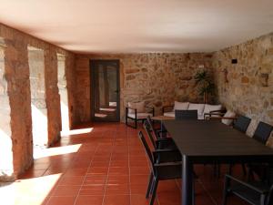 a dining room with tables and chairs in a building at Candeeira in Campia