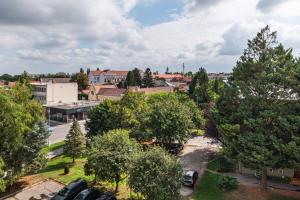 an aerial view of a city with trees and cars at The Nest - Komárno in Komárno