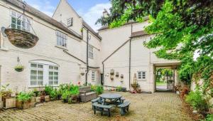 a patio with a table in front of a building at 2 bed Town Apartment in Shifnal