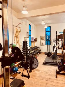 a gym with a bunch of equipment in a room at The Ocean Breeze bungalow in Sidi Kaouki