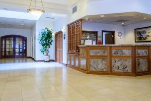 a large room with a lobby with a counter at SW Hotel in San Francisco