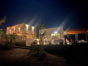 a house at night with the lights on at The Ocean Breeze bungalow in Sidi Kaouki