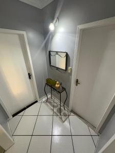 a room with a table and a mirror on the wall at Casa - Joinville in Joinville +11 photos