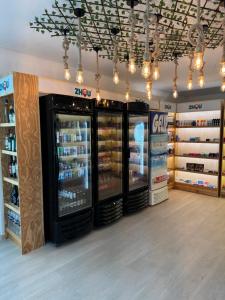 a store with two refrigerators in a grocery store at Carneiros Beach Resort 315 E in Praia dos Carneiros