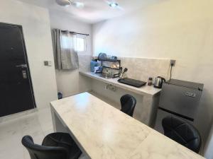 Η κουζίνα ή μικρή κουζίνα στο Departamentos Deluxe Villas Campestre