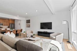 a living room with a couch and a table at Jordanelle Express Gondola Condo 3 BR Hot Tub in Cranmer