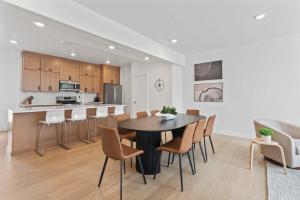 a kitchen and dining room with a table and chairs at Jordanelle Express Gondola Condo 3 BR Hot Tub in Cranmer