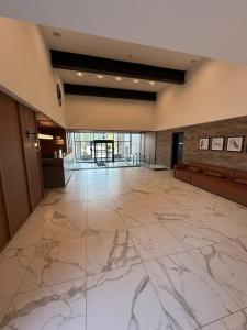 an empty lobby with a marble floor and a large room at Vibrant 1 Bedroom Condo Apt in Toronto +39 photos