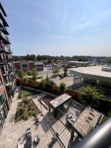 an overhead view of a courtyard with a bench on a building at Vibrant 1 Bedroom Condo Apt in Toronto