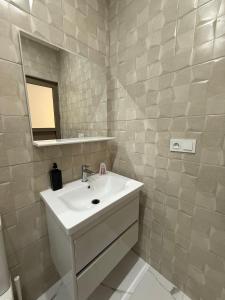 a bathroom with a sink and a mirror at Nour DAsilah 8 in Asilah +26 photos