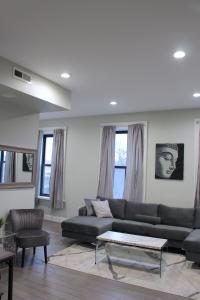 a living room with a couch and a table at Beautiful 2 BED 2 BATH Soaker Tub in Albany