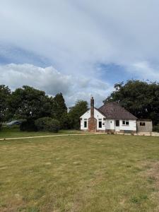 an old white house with a grassy field in front at Pendene in Hinton +27 photos