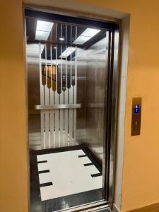 a display case with many knives in a elevator at Family paradise in Punta Cana in Punta Cana