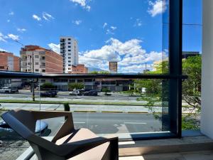a view of a city from a window at Torre Zurich Luxury in Medellín