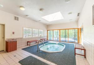 a large bathroom with a hot tub in the middle at Saints John 2520 by Summit County Mountain Retreats in Snake River Health Services Incorporated Heliport