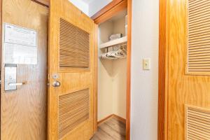 a door to a hallway with a closet at Lakeside 1489 by Summit County Mountain Retreats in Snake River Health Services Incorporated Heliport +37 photos