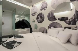 Ένα ή περισσότερα κρεβάτια σε δωμάτιο στο Nine Star Hotel