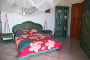 Ein Bett oder Betten in einem Zimmer der Unterkunft Hôtel Atiapiti