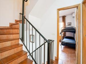 a staircase in a house with a bunk bed at Leisurely Apartment in Lepe with Swimming Pool in La Antilla +22 photos