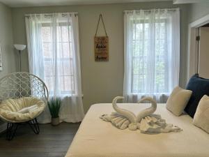 a bedroom with a bed with two towels on it at Bright & Airy 1 BDRM Private Apt in Albany