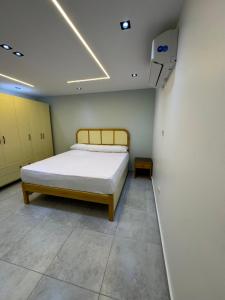 a bedroom with a bed in a room at The Royal Sea View Suite in Port Said
