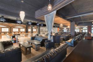 a bar with leather couches and tables and chairs at Harrah's New Orleans Hotel & Casino - A Caesars Rewards Destination in New Orleans +18 photos