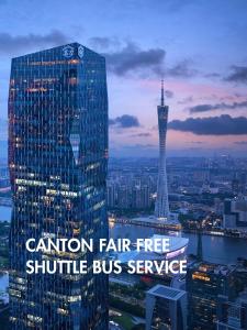 a tall building with a sign that reads caution fair free shuttle bus service at Park Hyatt Guangzhou in Guangzhou