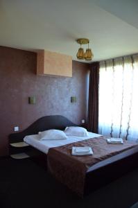 Un pat sau paturi într-o cameră la Villa Roberto