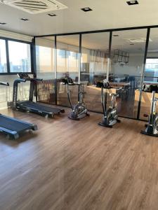 a gym with treadmills and ellipticals in a room at Studio Flat Cuiabá in Cuiabá +22 photos