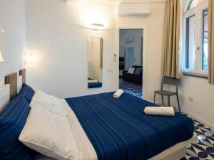 Ένα ή περισσότερα κρεβάτια σε δωμάτιο στο Seaside House With Terrace In Atrani