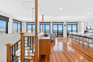 an open kitchen and dining room with a view of the ocean at Casa del Mar in Marengo