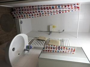 a bathroom with a toilet and a sink in a room at Apartment Lucia in Sveti Križ Začretje