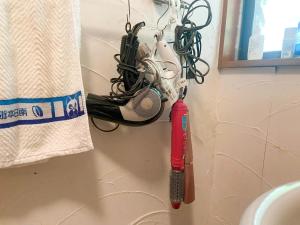 a wall with a hairbrush and other items on it at Glamping Himeshara - Vacation STAY 43046v in Kirishima +20 photos
