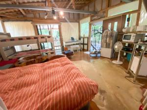 a room with a bed in the middle of a room at Glamping Himeshara - Vacation STAY 43046v in Kirishima