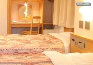 Postel nebo postele na pokoji v ubytování Hotel Estacion Hikone