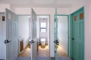 a bathroom with two doors and a toilet in it at Re,AERU - Vacation STAY 93903v in Minamiboso